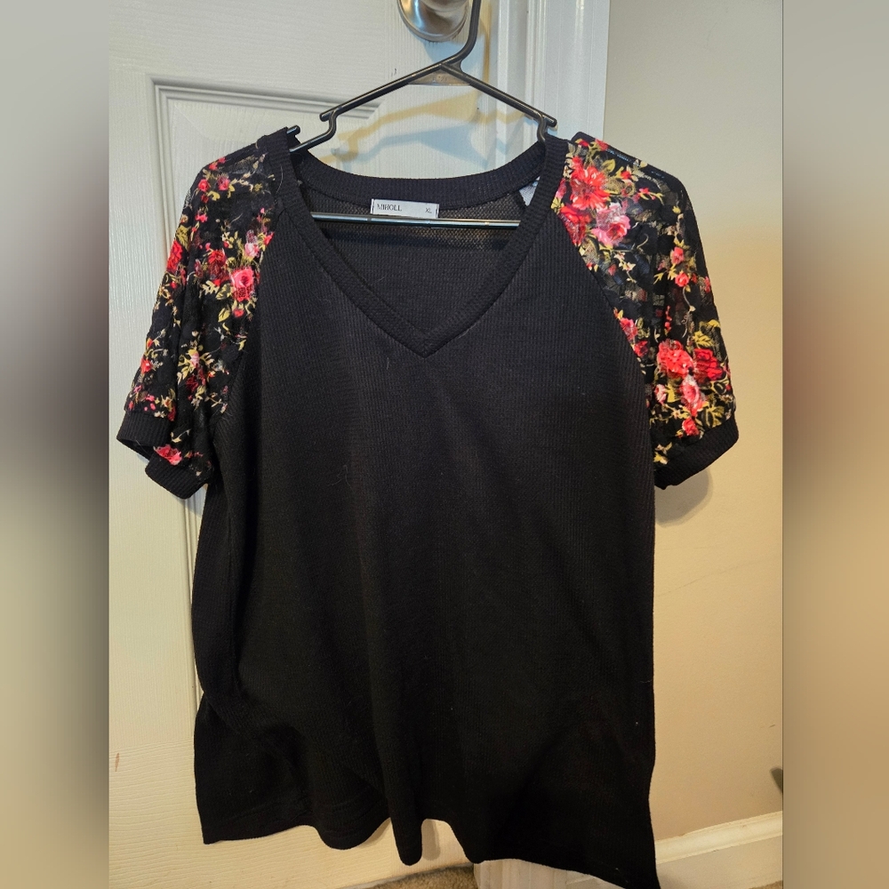 Pretty black top with floral shoulders
